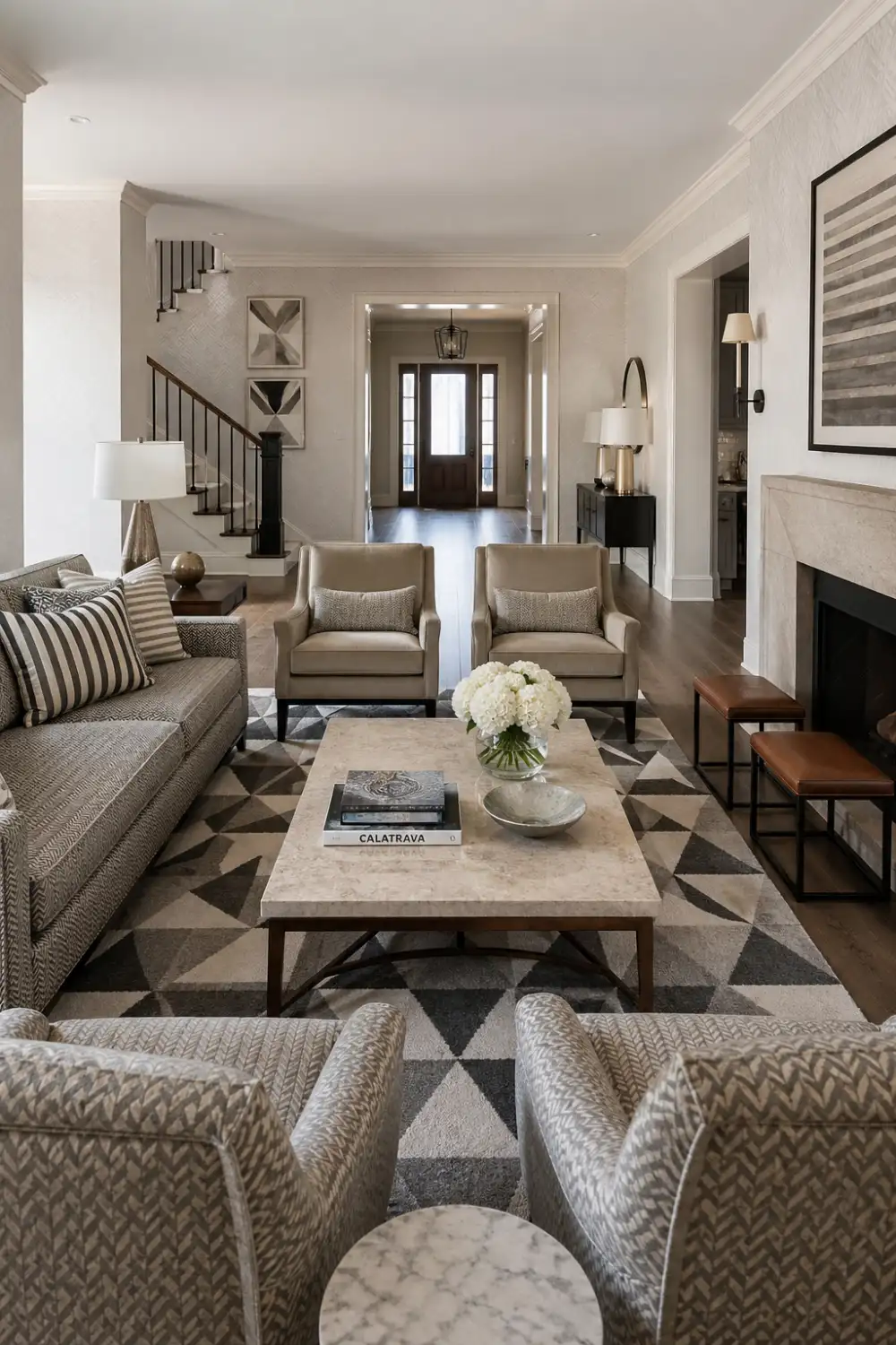 modern living room with geometric rug, patterned cushions, neutral furniture, layered textures, clean layout, contemporary interior design style