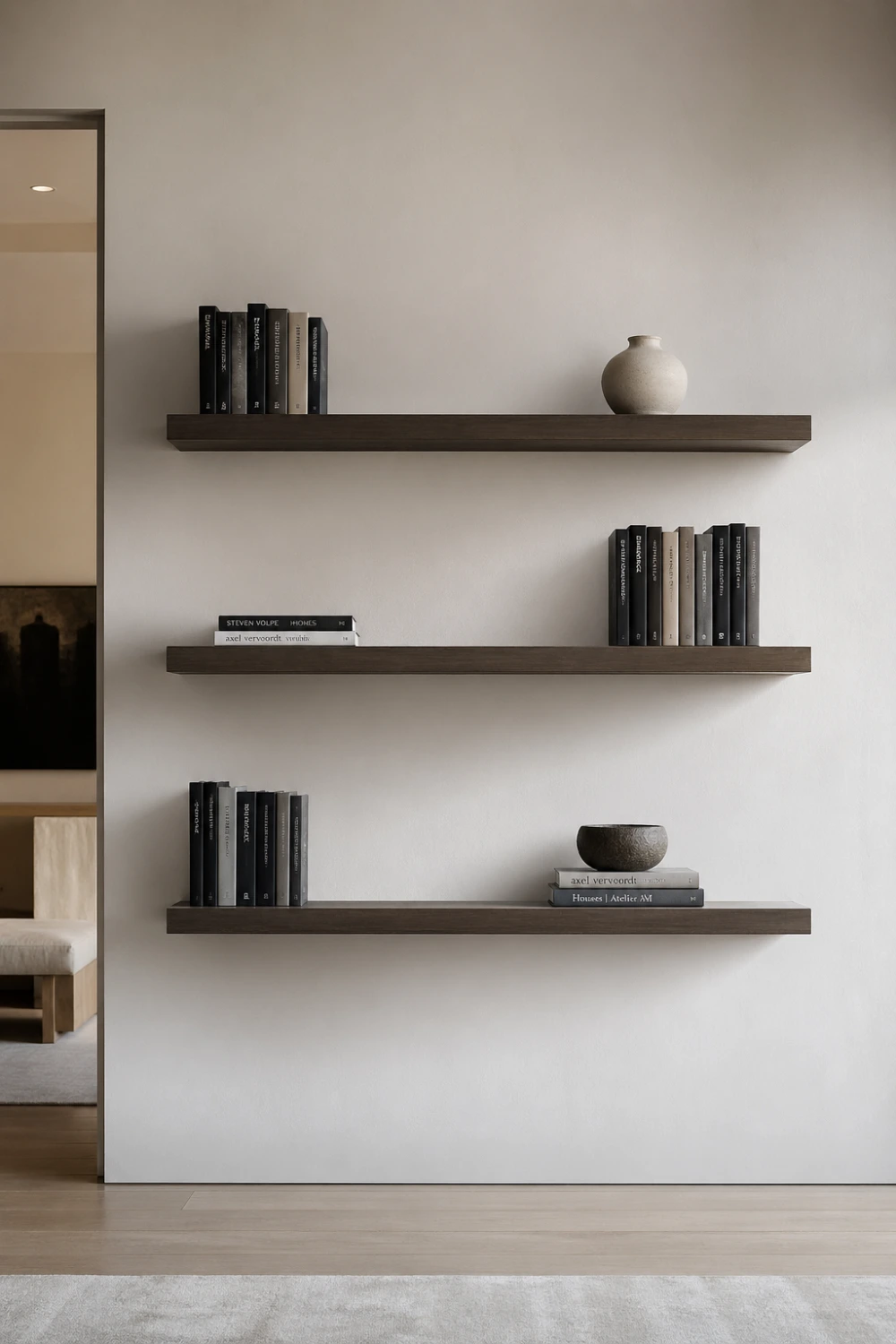 minimal floating wall shelves with books and simple decor, clean white wall, modern minimal bookshelf styling, airy shelf design with negative space, contemporary home decor