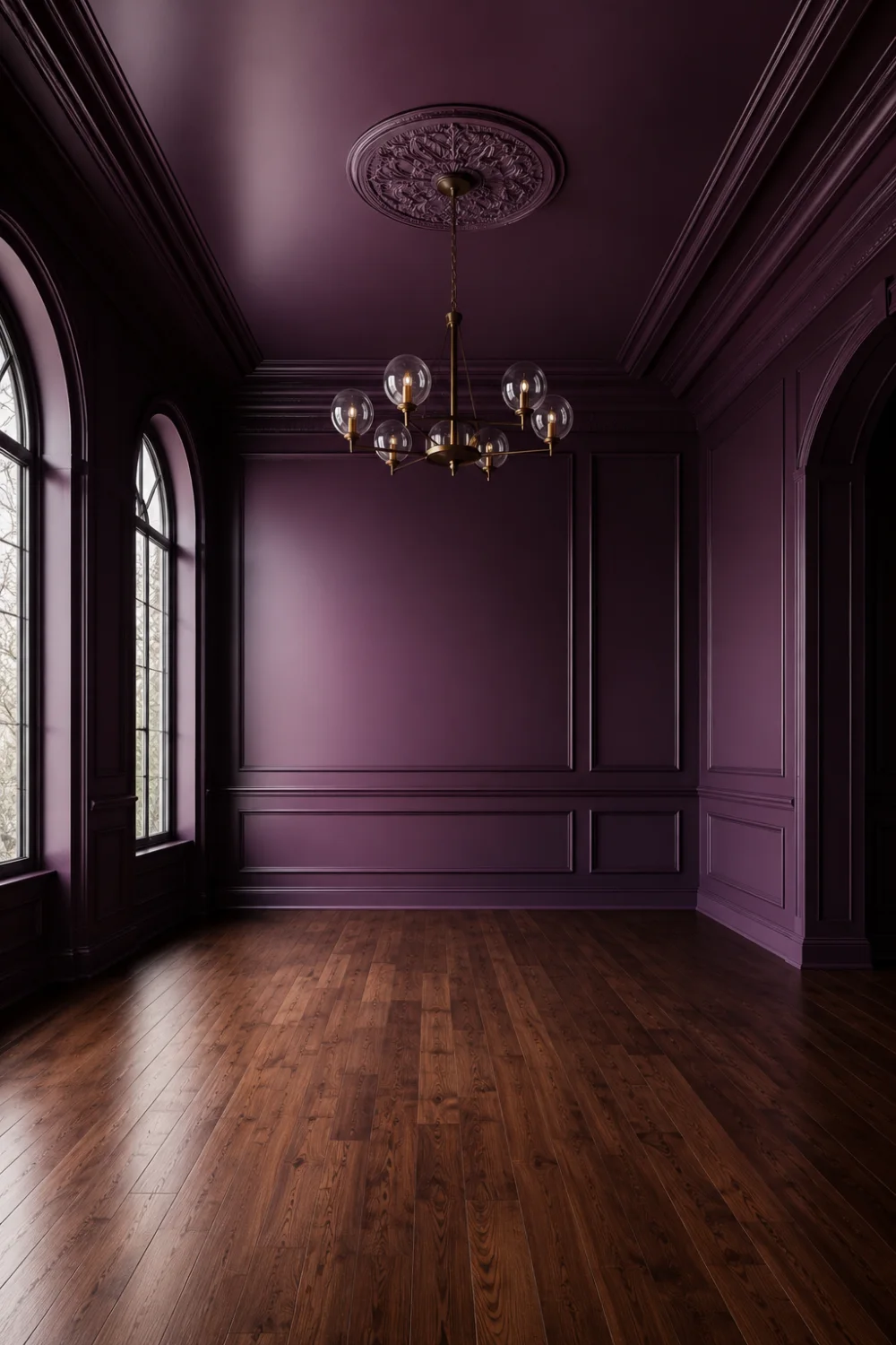 Dark purple bedroom retreat featuring matching plum walls and ceiling, decorative molding, arched windows, warm hardwood floors, luxury architectural details, and cozy modern bedroom design inspiration.